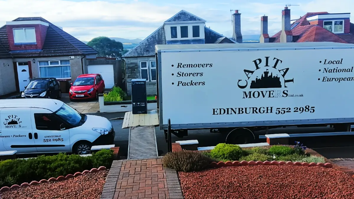 Capital Movers removal van with ramp deployed outside a residential property in Edinburgh
