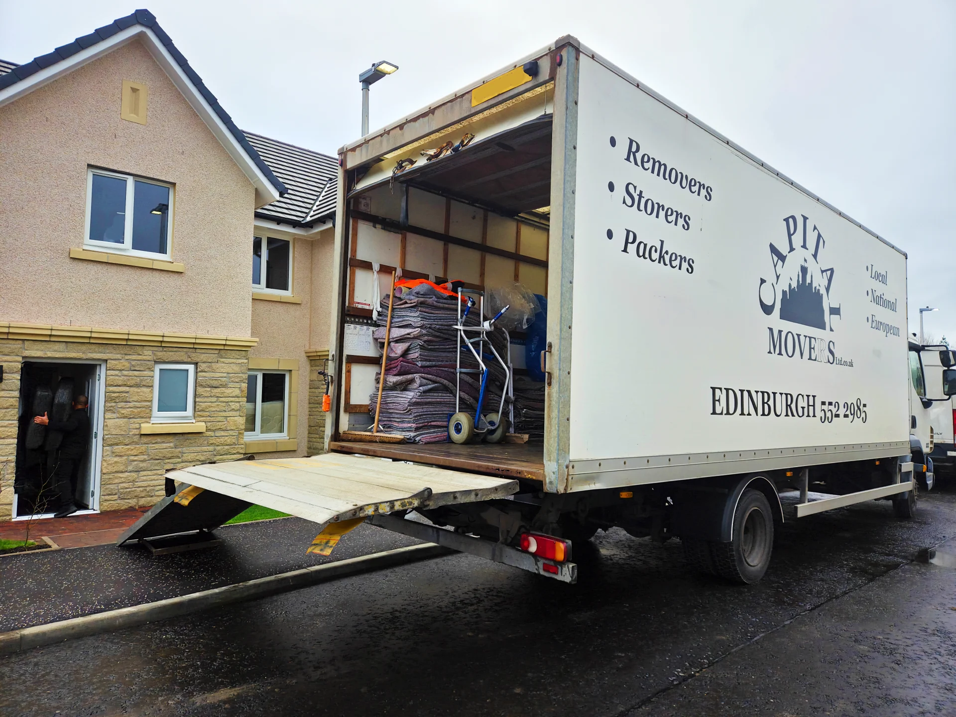 Capital Movers employee safely unpacking household items