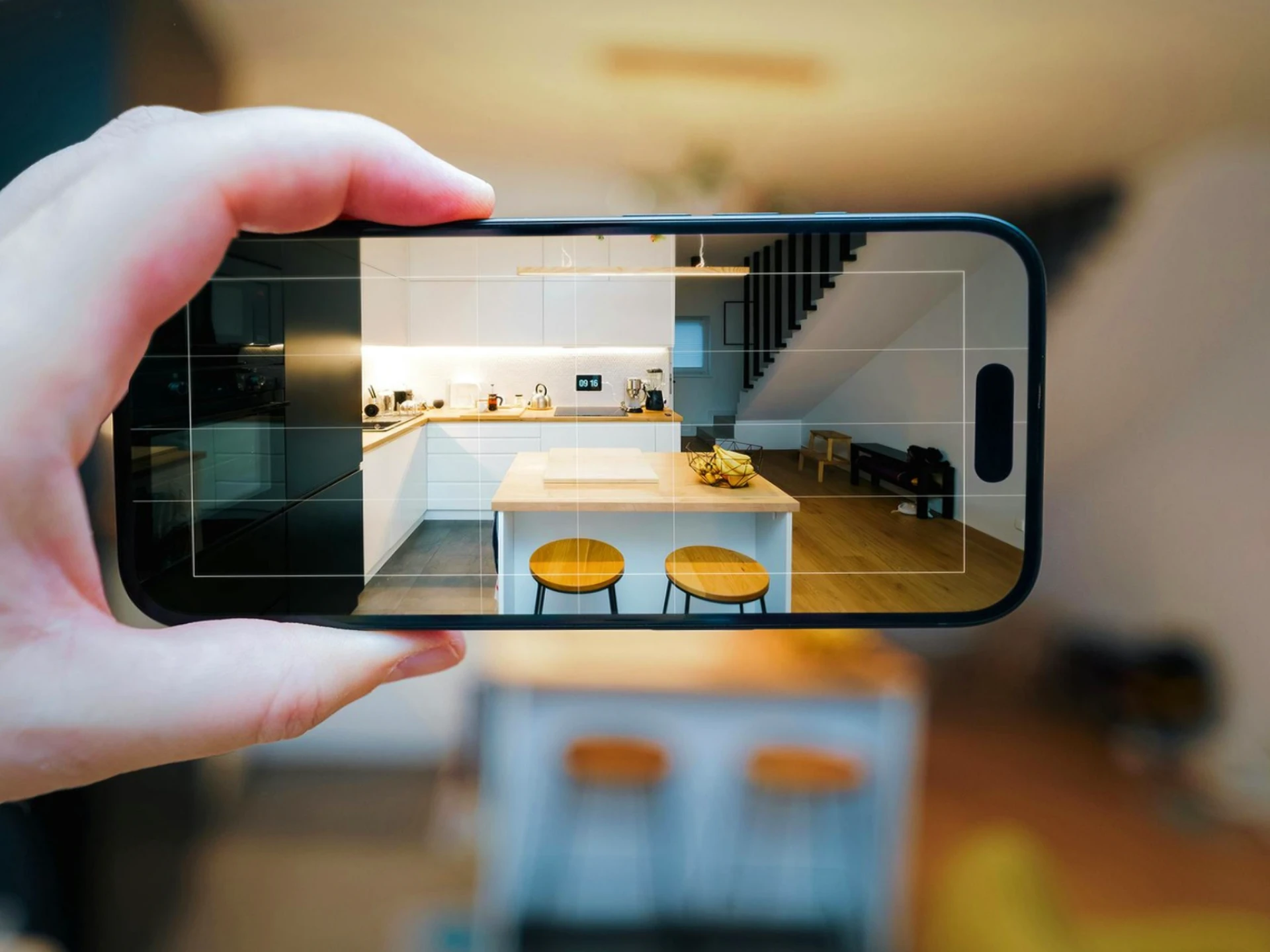 An image showing a customer on a video call showing Capital Movers their furniture.